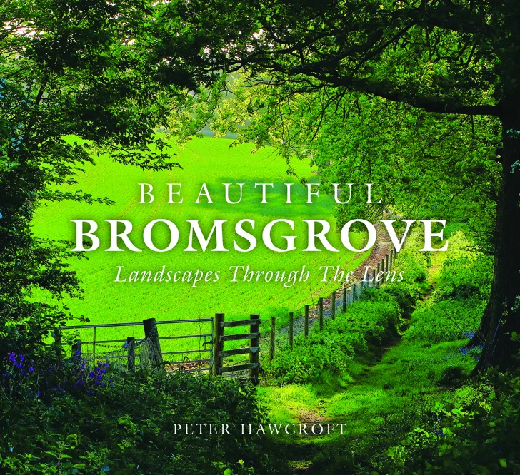The cover of Beautiful Bromsgrove: Landscapes Through The Lens by Peter Hawcroft: a grassy path and a fence line seen through overhanging trees