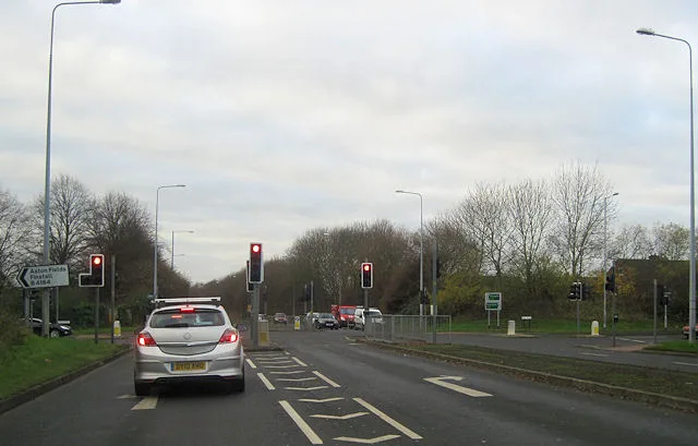 The A38 Bromsgrove Eastern Bypass at the signals where it meets New Road, the B4184, at Aston Fields. This is a file photograph taken in December 2011, before the junction rebuild now under way, and it does not show the collision