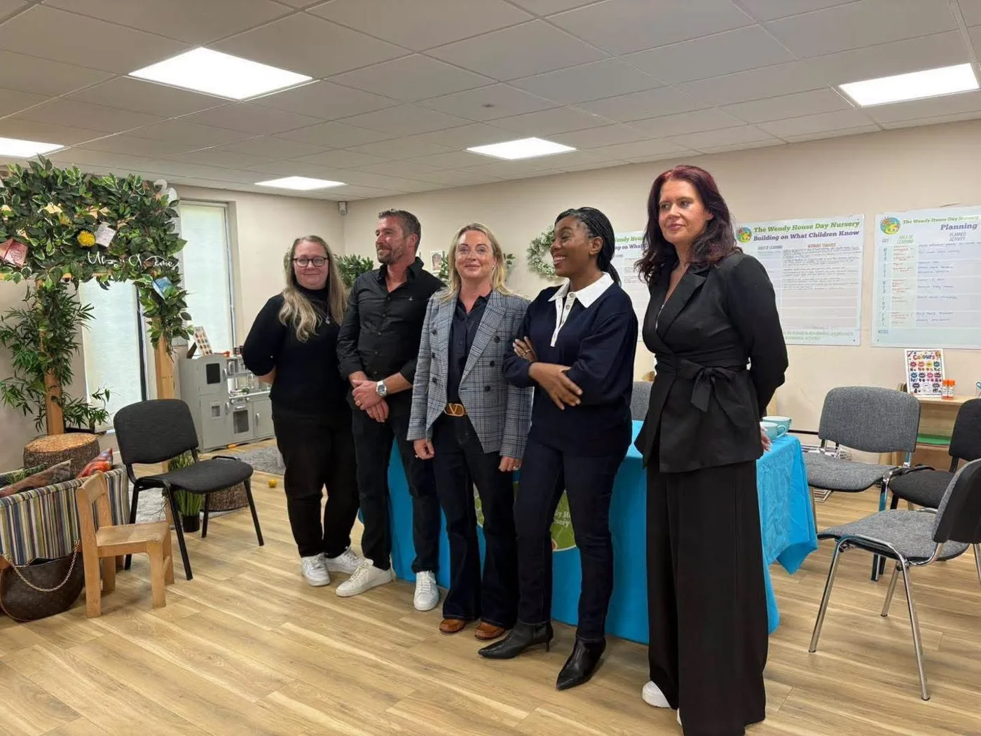 Kemi Badenoch with visitors and staff at The Wendy House Day Nursery in Wythall